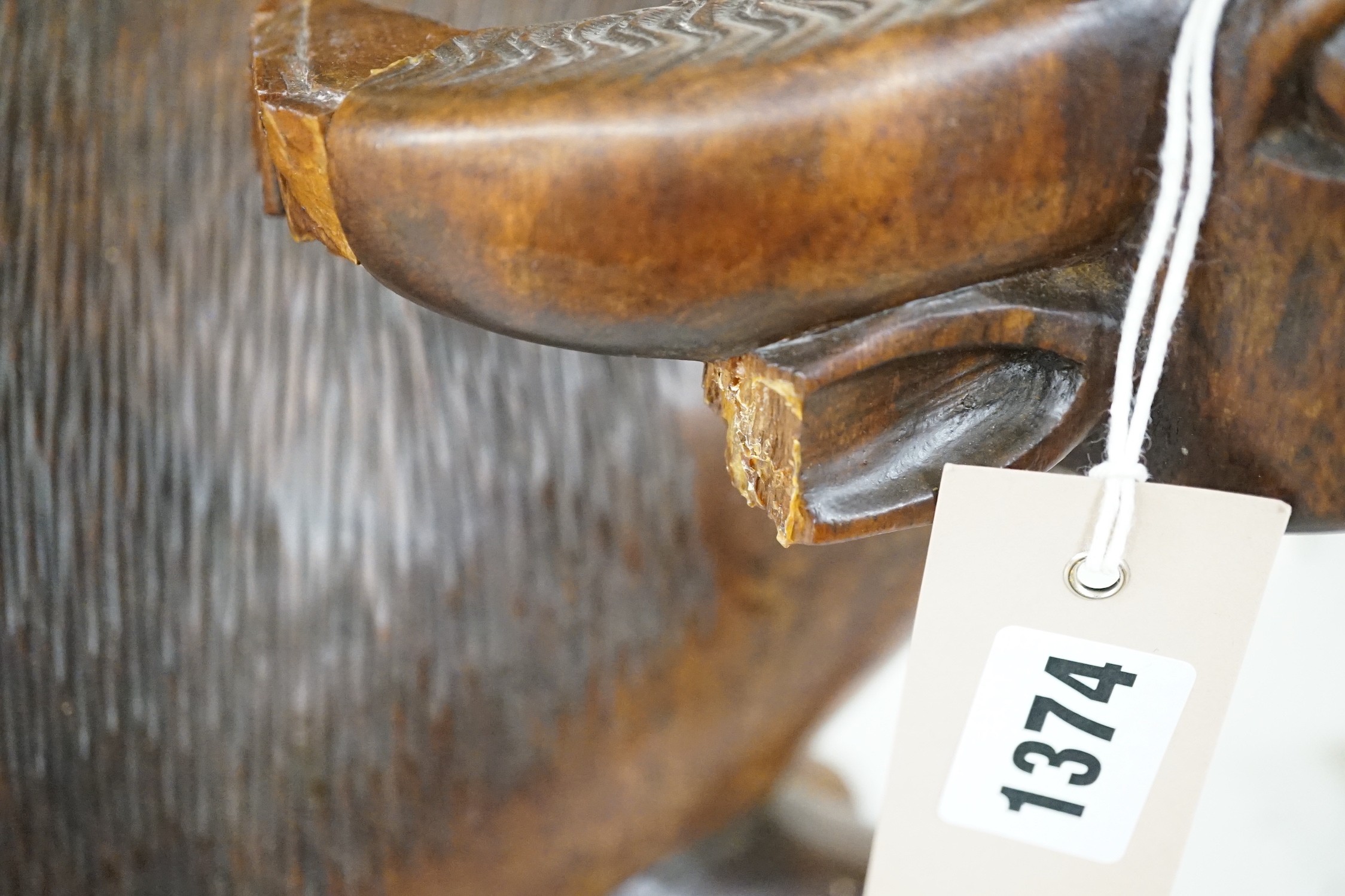 A pair of South East Asian carved wood figures of water buffalo, 43cm long